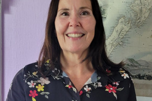 Maria Luisa has a big smile and dark hair